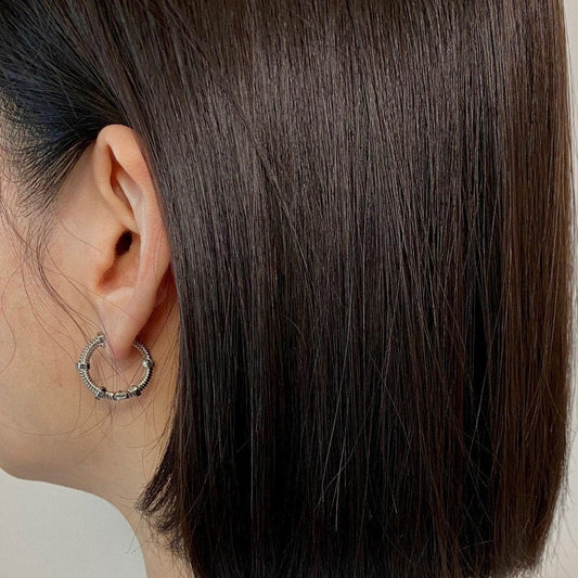 Huolo Earrings in Silver