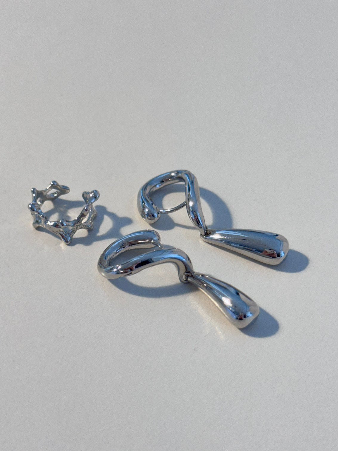 CXD earrings in Silver