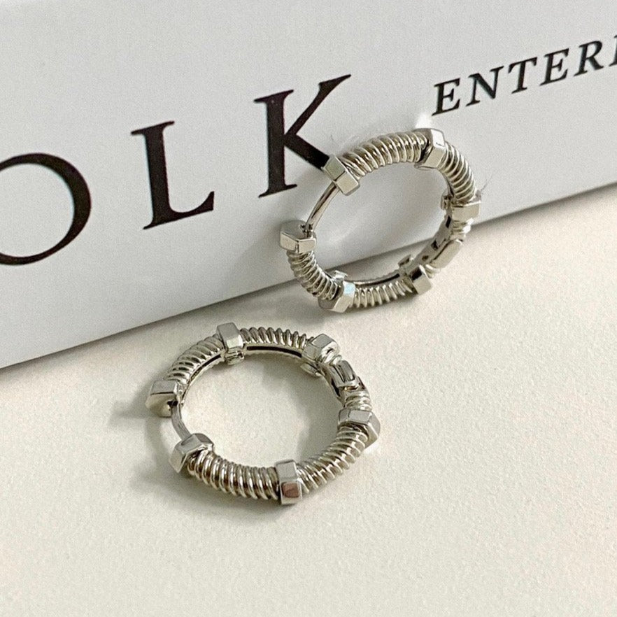 Huolo Earrings in Silver