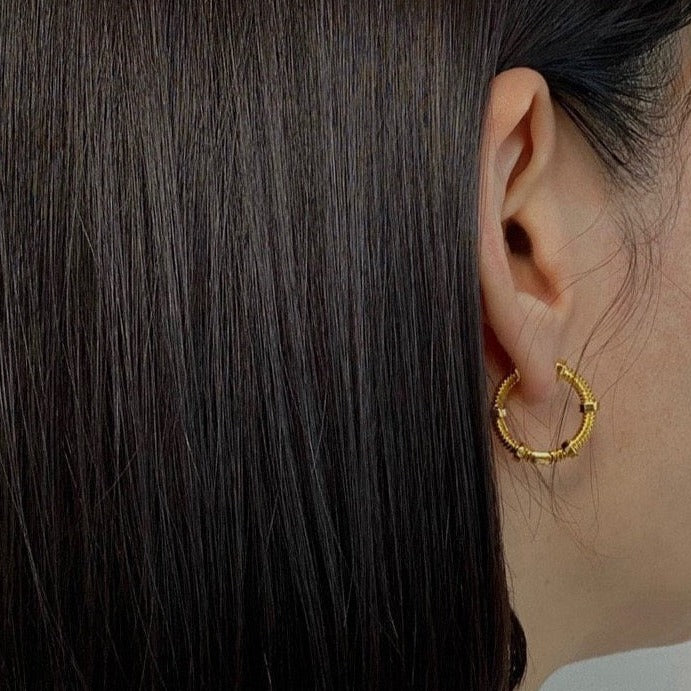 Huolo Earrings in Gold